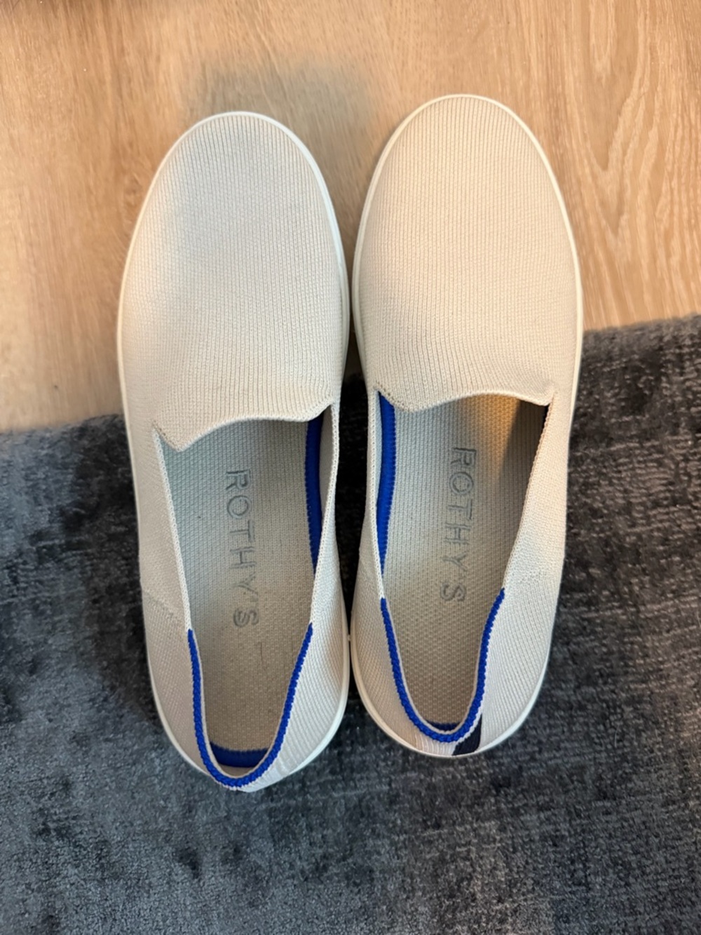 Rothy's Slip-On Sneakers in Cream with Blue Trim